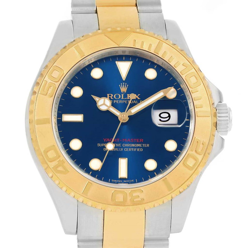 This image shows a frontal view of a Rolex Yacht-Master watch, highlighting its blue dial, golden bezel, and two-tone bracelet.