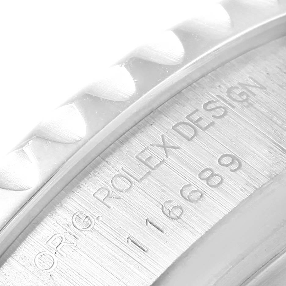 This close-up image of the Rolex Yacht-Master 116689 Men's White Gold White Dial 116689 Men's White Gold White Dial shows the engraved inner bezel with "ORIG ROLEX DESIGN" and the model number "116689."