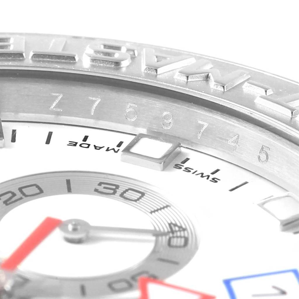 This close-up shot of the Rolex Yacht-Master 116689 Men's White Gold White Dial 116689 Men's White Gold White Dial watch shows the bezel, part of the dial, and hands.