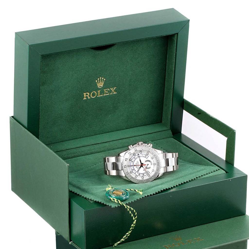 The Rolex Yacht-Master 116689 Men's White Gold White Dial 116689 Men's White Gold White Dial watch is shown in an open green Rolex box, displaying the watch face and bracelet.