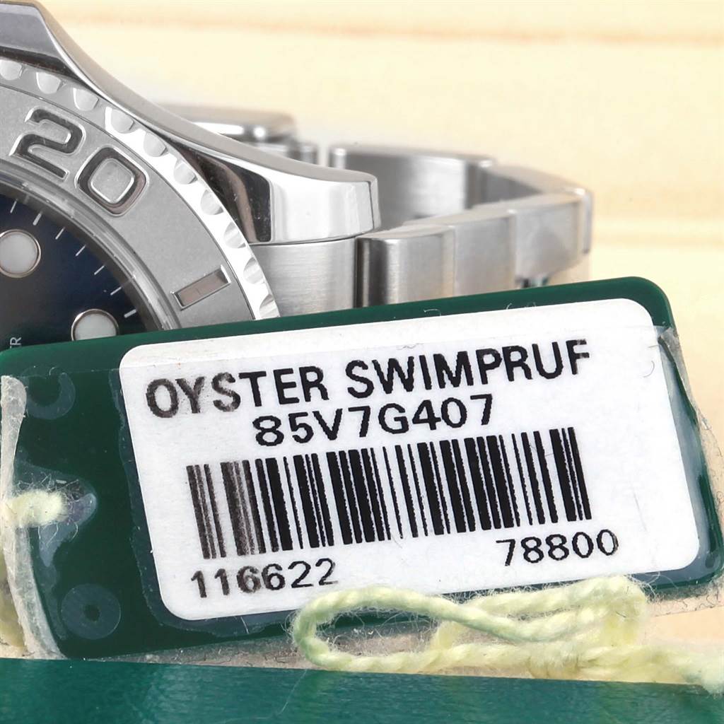 The image shows a close-up side view of the Rolex Yacht-Master 116622 Men's Stainless Steel Blue Dial 116622 Men's Stainless Steel Blue Dial watch, focusing on the bezel and part of the bracelet, with an Oyster Swimpruf tag.