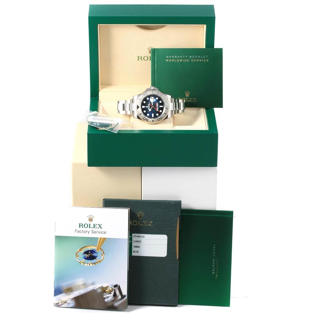The image shows a Rolex Yacht-Master 116622 Men's Stainless Steel Blue Dial 116622 Men's Stainless Steel Blue Dial watch in its open box, surrounded by warranty booklets and a factory service manual.