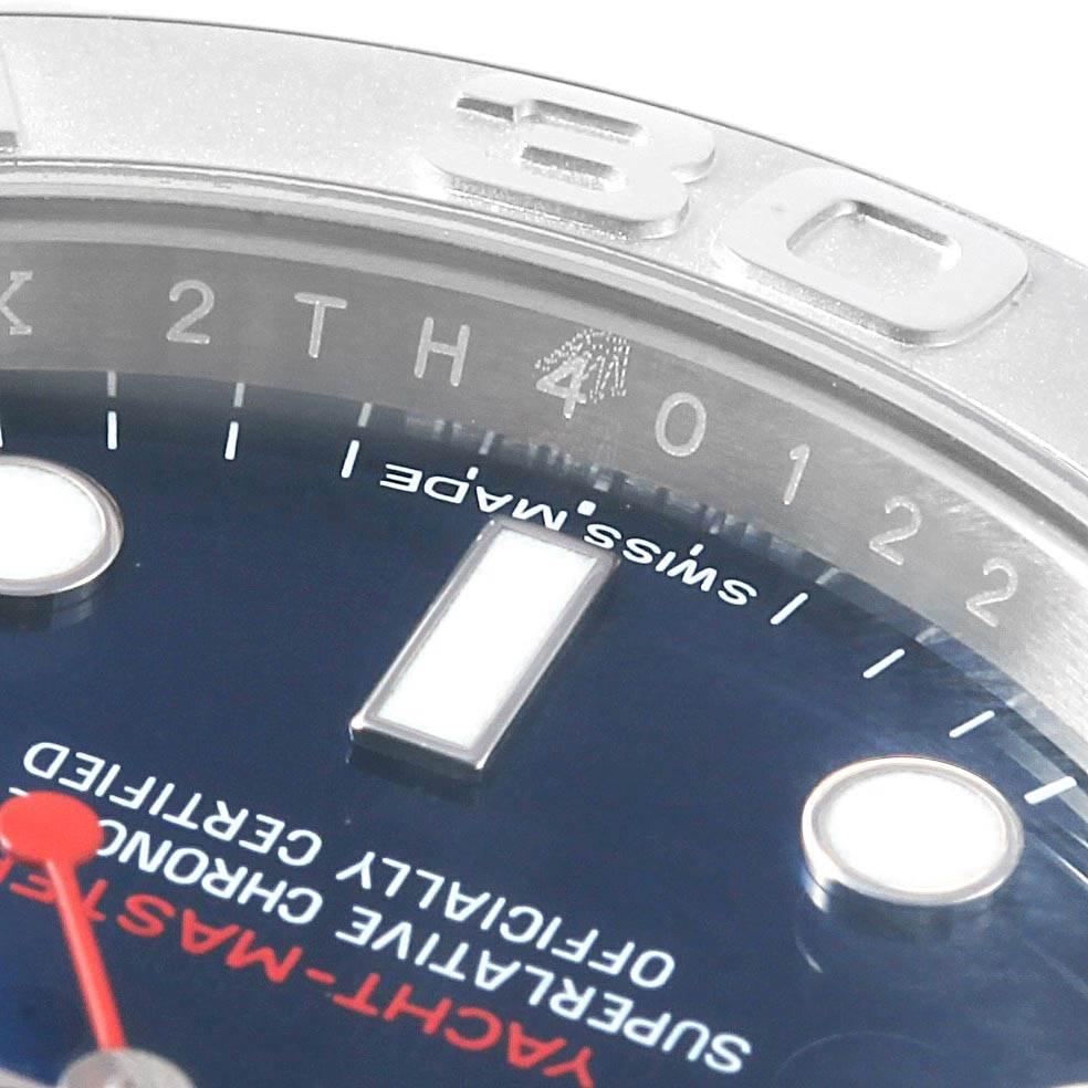 This close-up image of the Rolex Yacht-Master 116622 Men's Stainless Steel Blue Dial 116622 Men's Stainless Steel Blue Dial watch displays the bezel, dial markings, and partial hands.