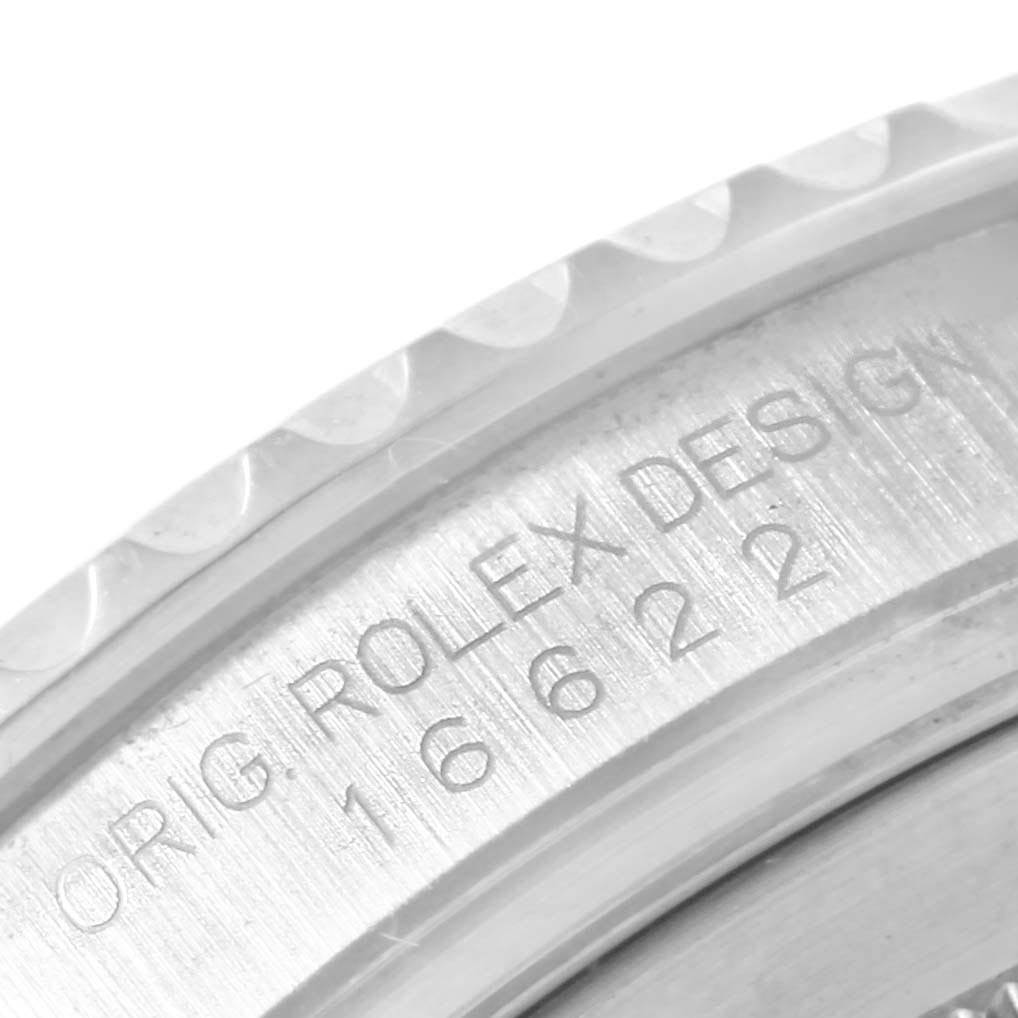 This close-up shows the engraved details on the caseback rim of a Rolex Yacht-Master 16622 Men's Stainless Steel Silver Dial 16622 Men's Stainless Steel Silver Dial.