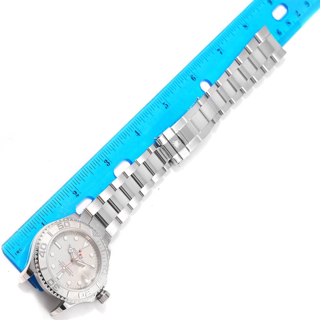 The image shows a Rolex Yacht-Master 16622 Men's Stainless Steel Silver Dial 16622 Men's Stainless Steel Silver Dial watch placed horizontally next to a ruler, displaying the face and bracelet.