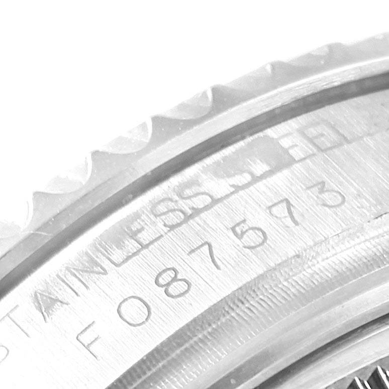 This close-up image shows the stainless steel inscription and part of the bezel of the Rolex Yacht-Master 168622 Men's Stainless Steel Silver Dial 168622 Men's Stainless Steel Silver Dial watch.