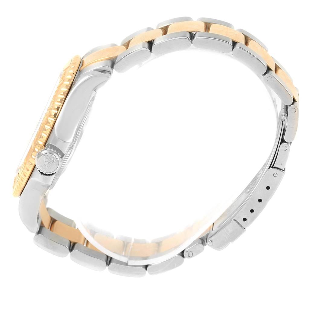 This side view of the Rolex Yacht-Master 16623 Men's Stainless Steel Grey Dial 16623 Men's Stainless Steel Grey Dial model shows the crown, bezel, and bi-metal bracelet.