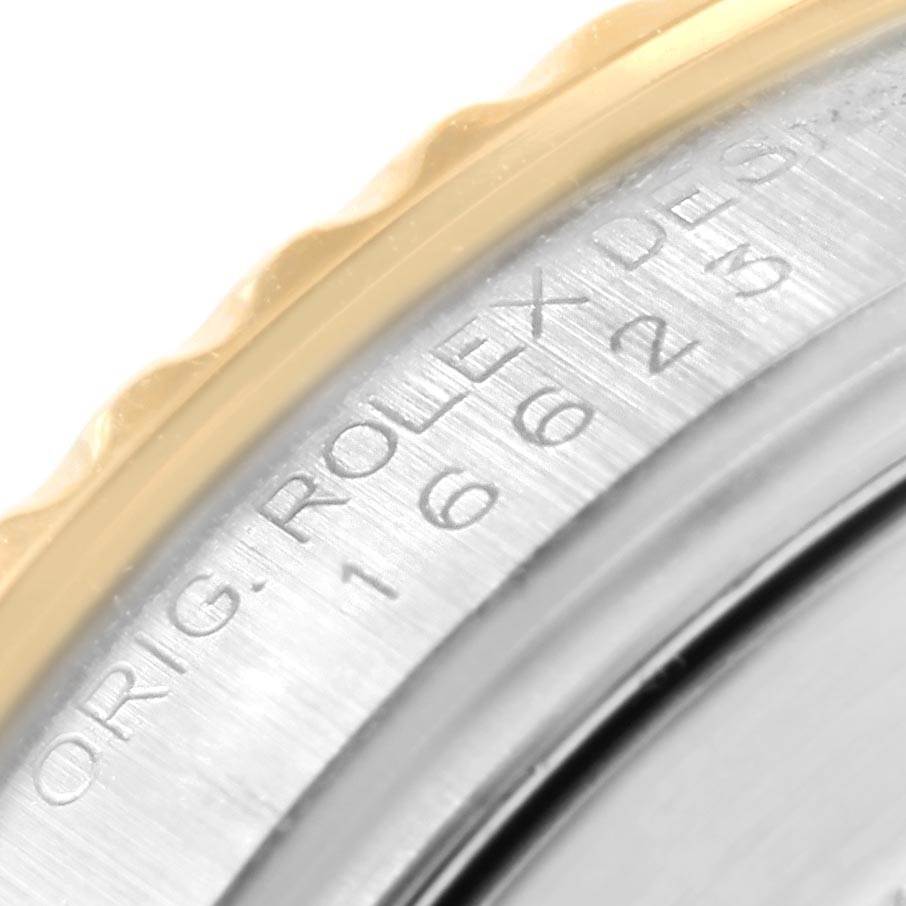 This close-up shows the outer bezel and the engraved case back of the Rolex Yacht-Master 16623 Men's Stainless Steel Grey Dial 16623 Men's Stainless Steel Grey Dial watch.