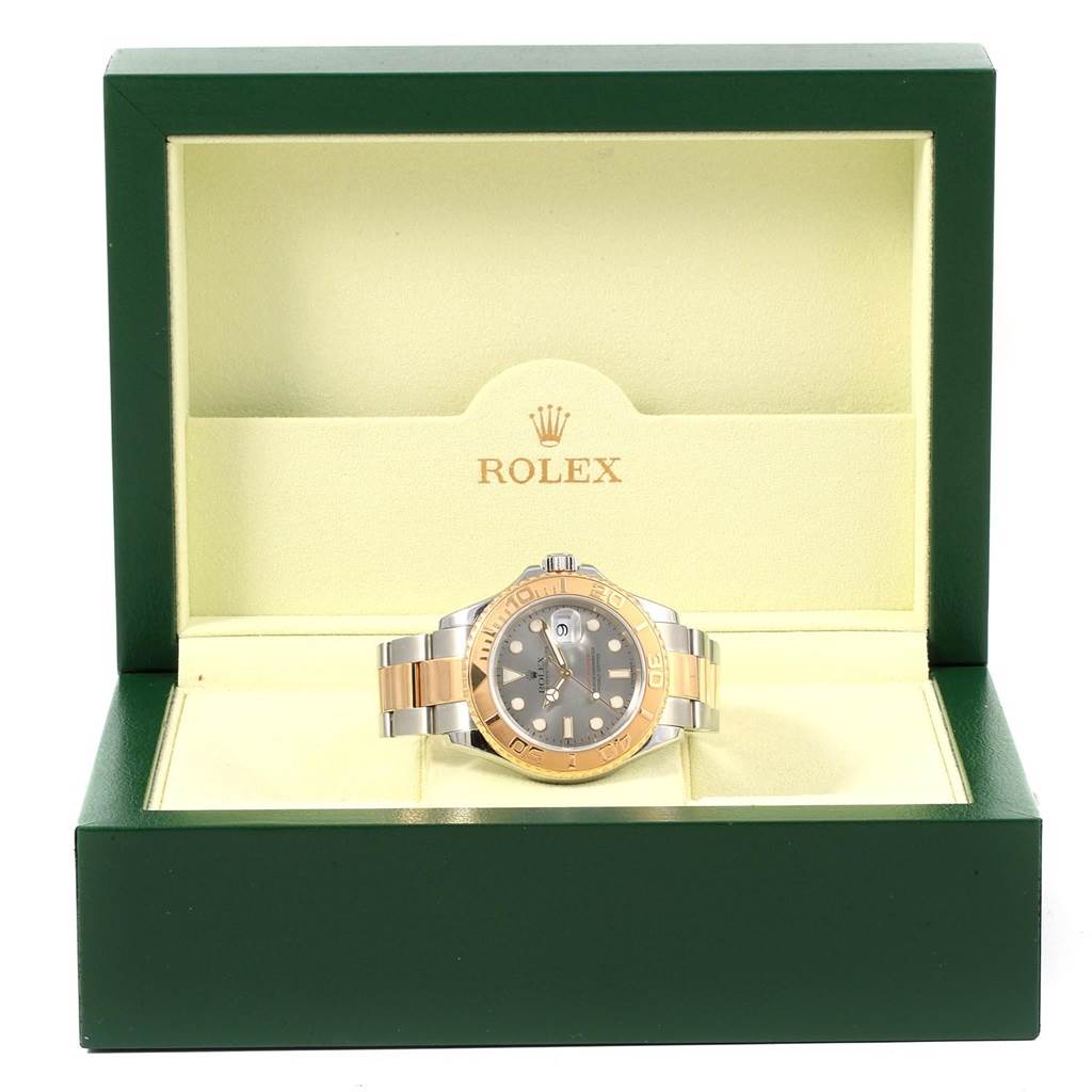 The Rolex Yacht-Master 16623 Men's Stainless Steel Grey Dial 16623 Men's Stainless Steel Grey Dial watch is displayed front-facing in an open green and beige box.