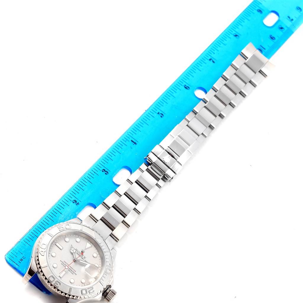 The image shows a Rolex Yacht-Master 16622 Men's Stainless Steel Silver Dial 16622 Men's Stainless Steel Silver Dial watch laid flat next to a ruler, displaying the face and band in a top-down view.