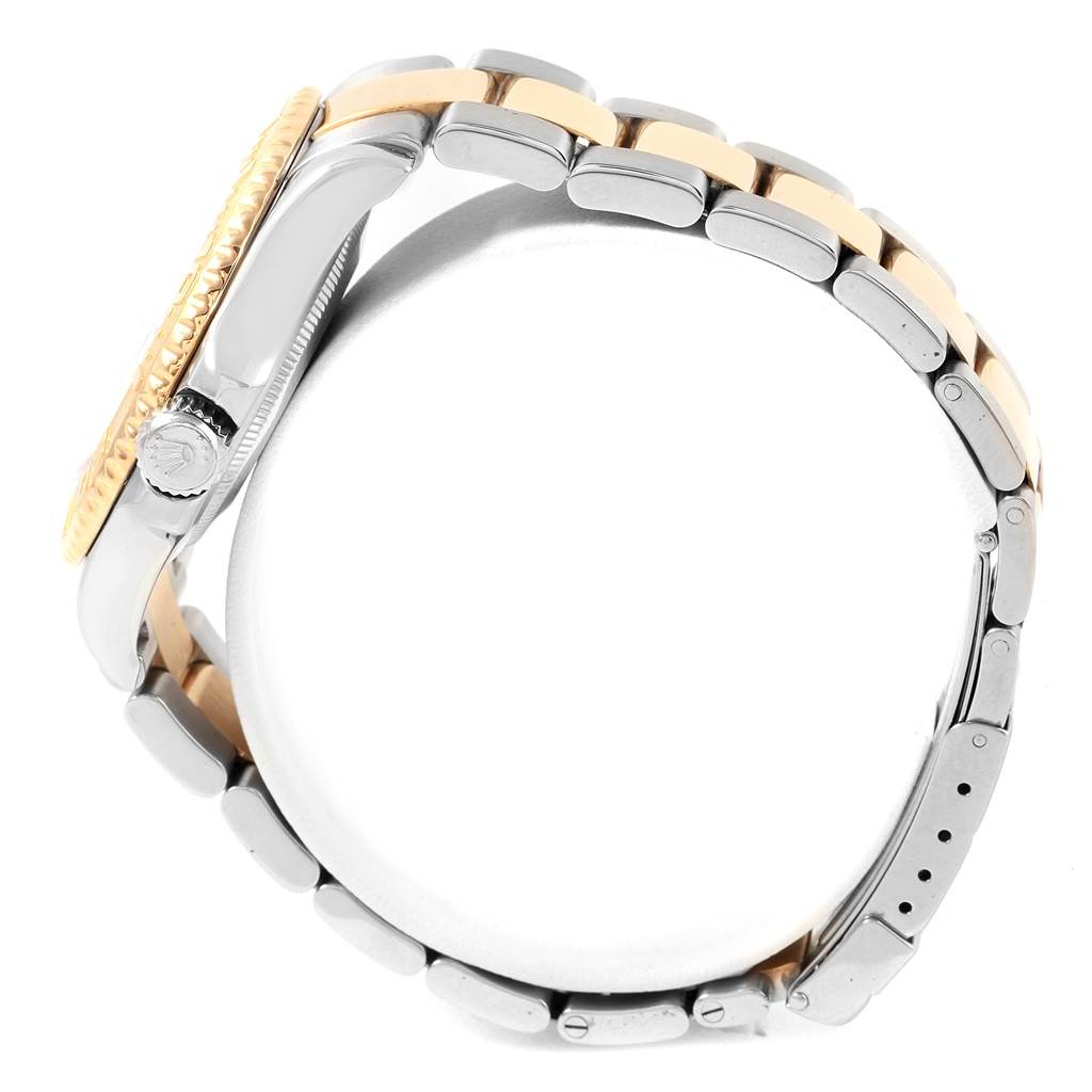 The image shows a side view of a Rolex Yacht-Master 16623 Men's Stainless Steel Blue Dial 16623 Men's Stainless Steel Blue Dial watch, highlighting the bezel, crown, and metal bracelet.