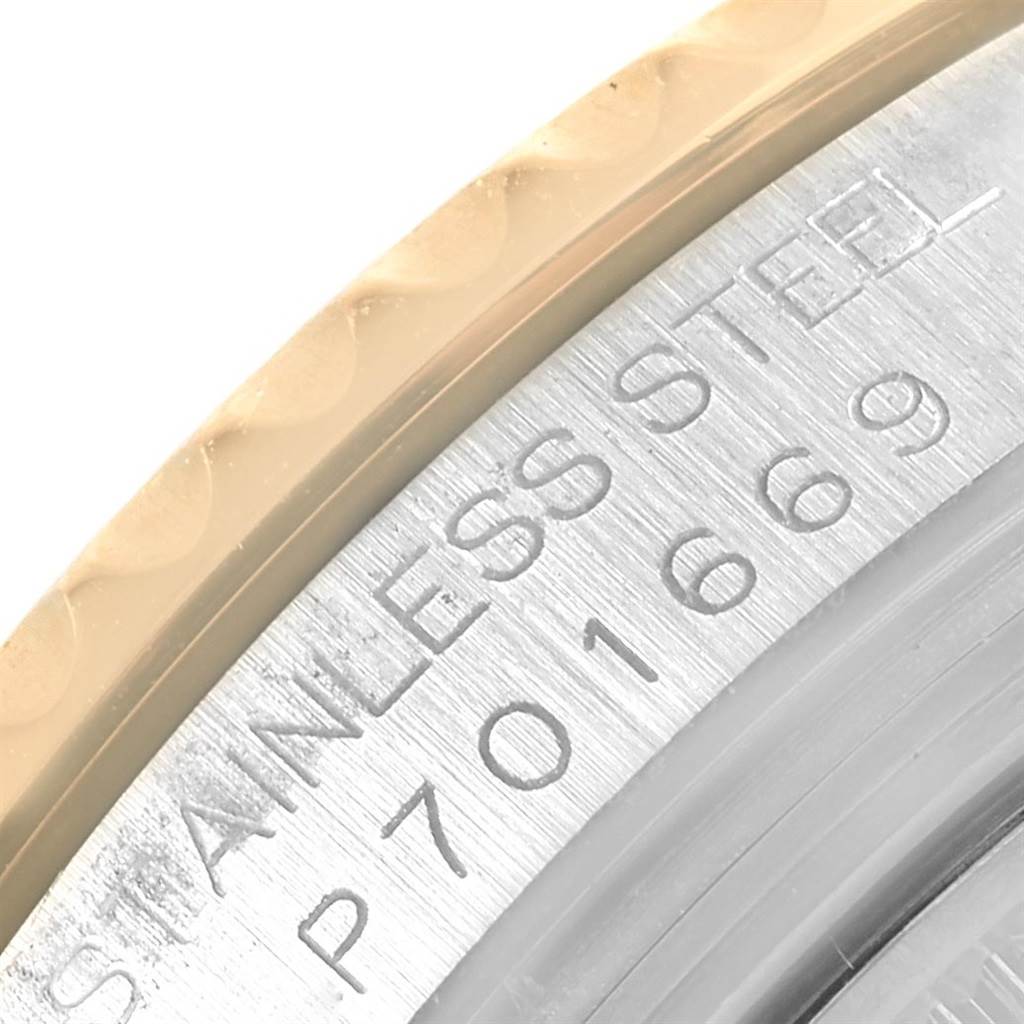 The image shows a close-up of the side of a Rolex Yacht-Master 168623 Men's Steel and Gold (two tone) Grey Dial 168623 Men's Steel and Gold (two tone) Grey Dial, featuring part of the bezel and serial number engraving.