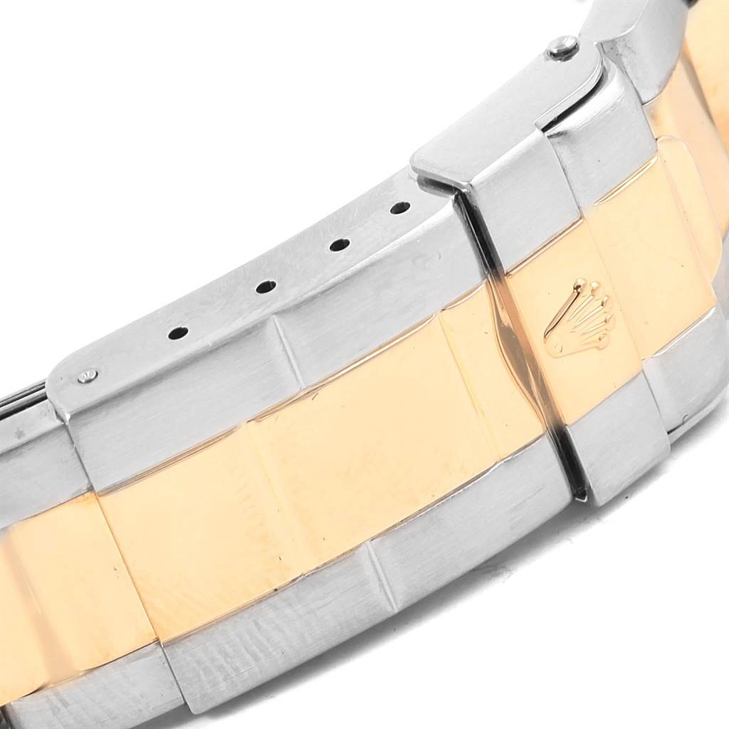 This image shows a close-up of the two-toned bracelet clasp of a Rolex Yacht-Master 168623 Men's Steel and Gold (two tone) Grey Dial 168623 Men's Steel and Gold (two tone) Grey Dial watch.