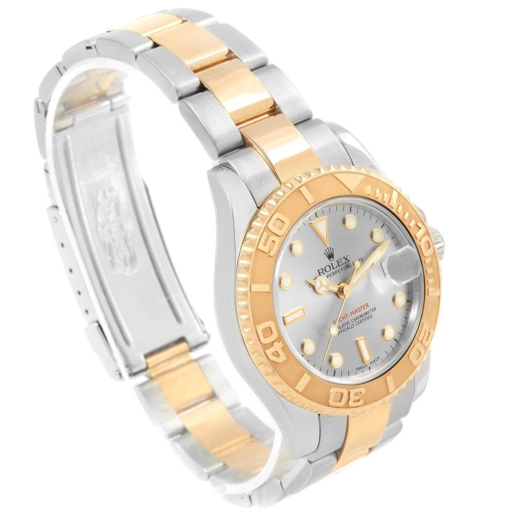 The image shows a side angle of a Rolex Yacht-Master 168623 Men's Steel and Gold (two tone) Grey Dial 168623 Men's Steel and Gold (two tone) Grey Dial watch, highlighting its two-tone bracelet, bezel, and dial.