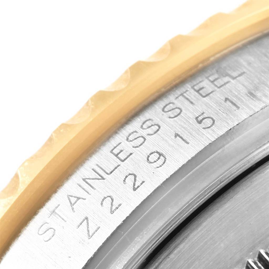 The image shows a close-up angle of the Rolex Yacht-Master 16623 Men's Stainless Steel Champagne Dial 16623 Men's Stainless Steel Champagne Dial watch, highlighting the stainless steel bezel with serial number engraving.