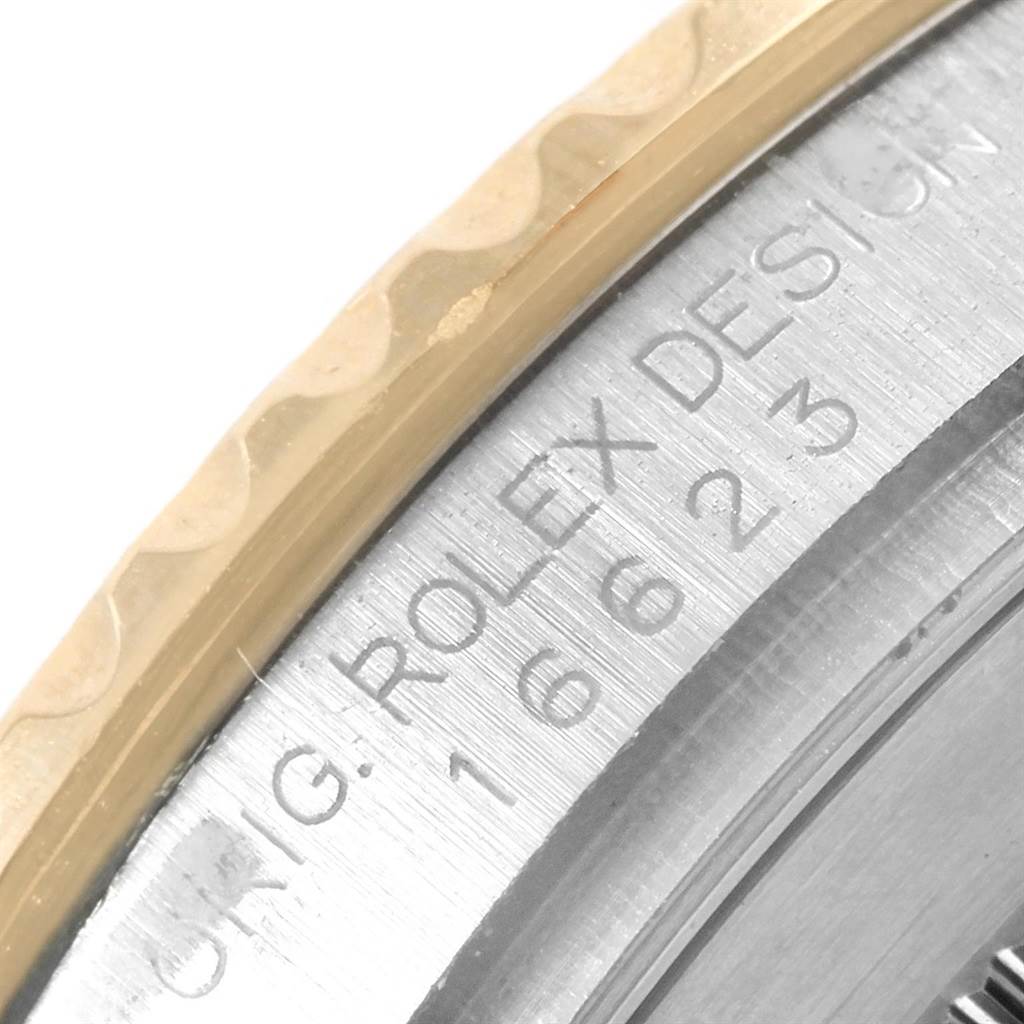 This close-up image of a Rolex Yacht-Master 16623 Men's Stainless Steel Grey Dial 16623 Men's Stainless Steel Grey Dial displays the outer rim and engraved model number on the watch case.