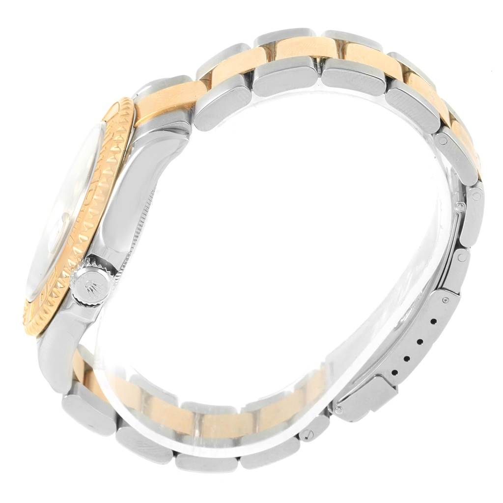 The image displays a side view of the Rolex Yacht-Master 16623 Men's Stainless Steel Grey Dial 16623 Men's Stainless Steel Grey Dial watch, focusing on the crown, bezel, and part of the two-tone bracelet.