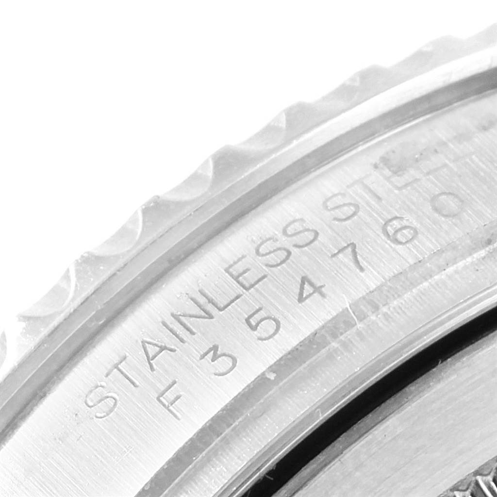 The image shows a close-up of the edge and engraving on the bezel of a Rolex Yacht-Master 16622 Men's Stainless Steel Silver Dial 16622 Men's Stainless Steel Silver Dial watch, highlighting the stainless steel material.