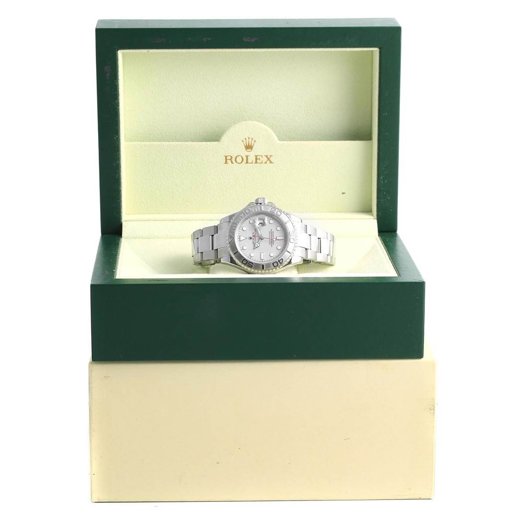The Rolex Yacht-Master 16622 Men's Stainless Steel Silver Dial 16622 Men's Stainless Steel Silver Dial watch is shown head-on inside an open green and cream box with the Rolex logo.