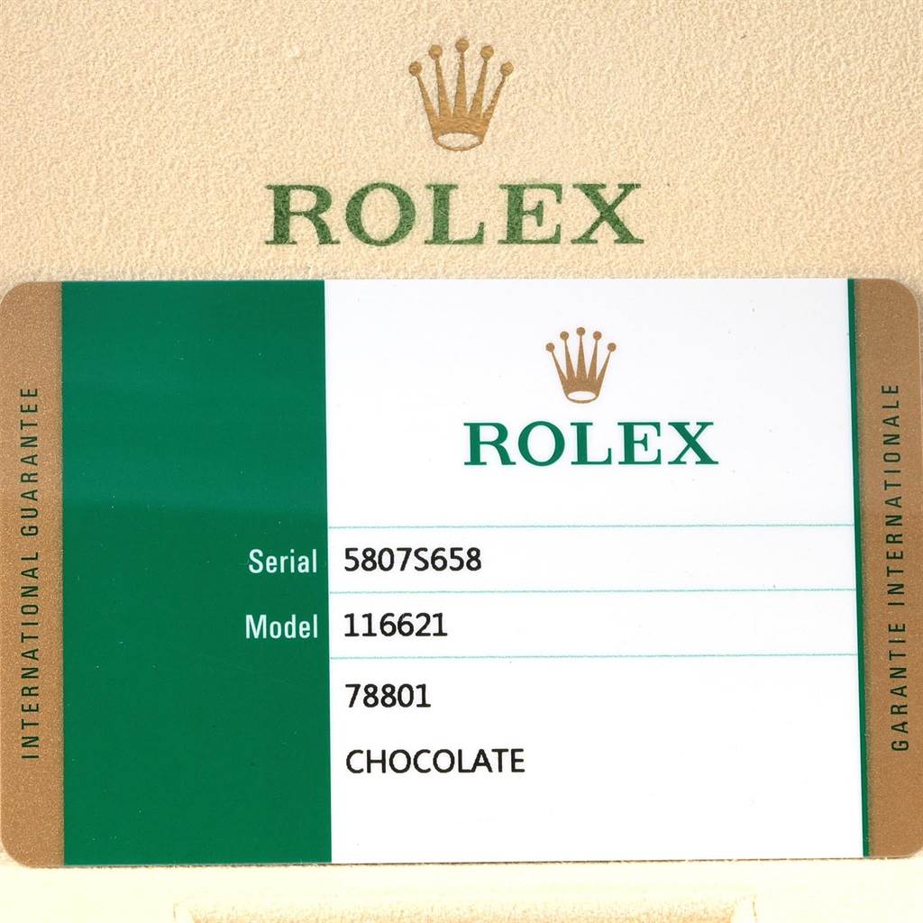 This image shows the international guarantee card for the Rolex Yacht-Master 116621 Men's Stainless Steel Brown Dial 116621 Men's Stainless Steel Brown Dial model 116621 with a chocolate dial.