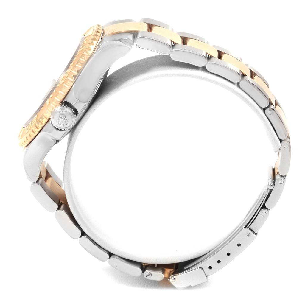 The image shows a side view of the Rolex Yacht-Master 16623 Men's Stainless Steel Blue Dial 16623 Men's Stainless Steel Blue Dial watch, highlighting its case, crown, and bracelet.