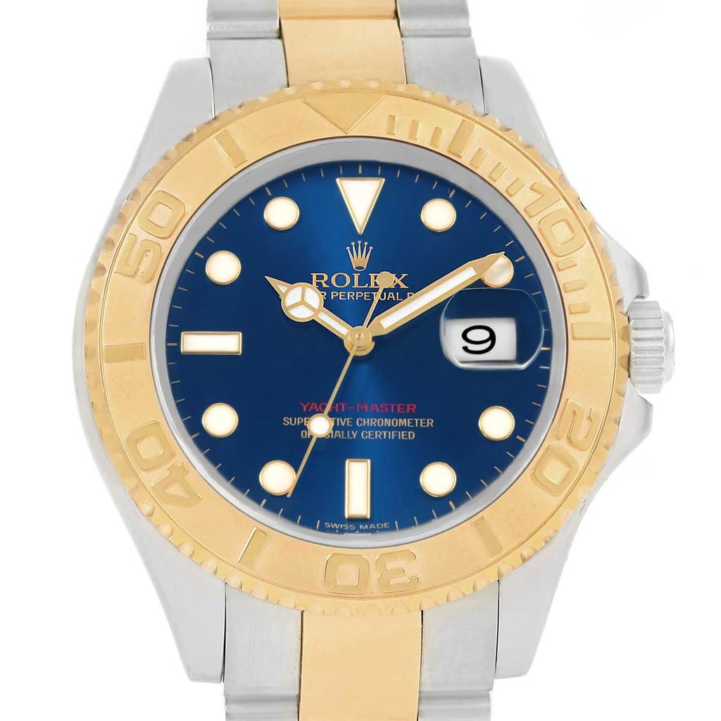 The image shows a front view of a Rolex Yacht-Master 16623 Men's Stainless Steel Blue Dial 16623 Men's Stainless Steel Blue Dial watch with a blue dial and a two-tone gold and silver bracelet.