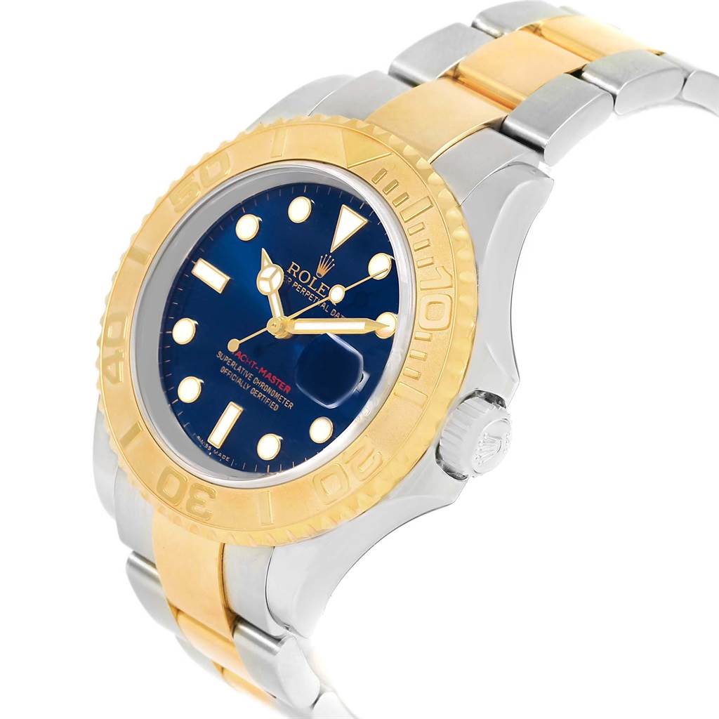 This Rolex Yacht-Master 16623 Men's Stainless Steel Blue Dial 16623 Men's Stainless Steel Blue Dial model is shown at a slight angle displaying its blue dial, gold bezel, and two-tone bracelet.