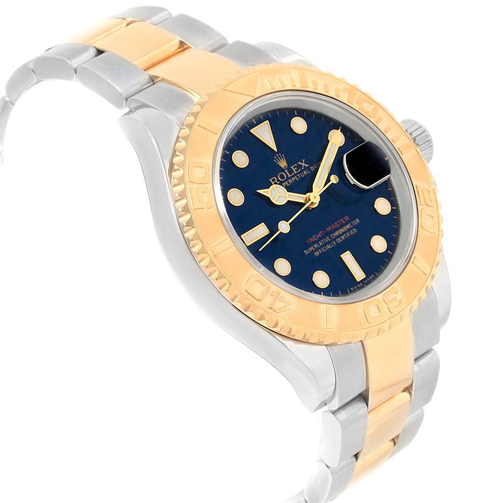 The Rolex Yacht-Master 16623 Men's Stainless Steel Blue Dial 16623 Men's Stainless Steel Blue Dial watch is shown at a three-quarter angle, displaying its dial, bezel, and part of the bracelet.