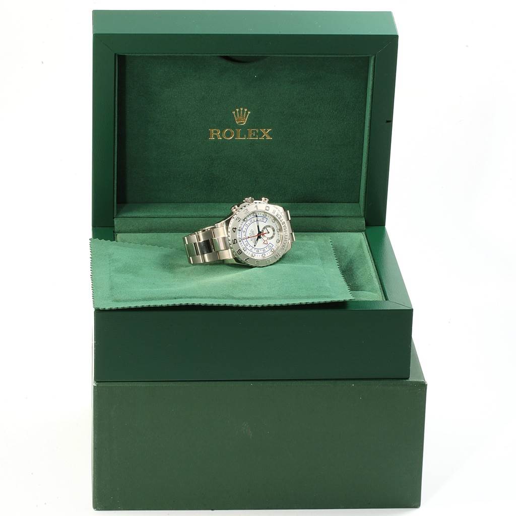 The Rolex Yacht-Master 116689 Men's White Gold White Dial 116689 Men's White Gold White Dial watch is displayed at an angle inside a green Rolex box, showing the watch face and bracelet.