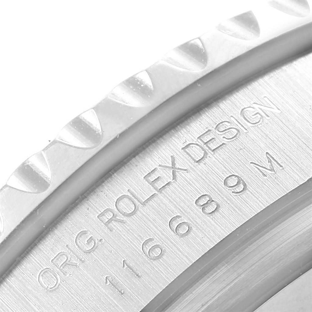 This image shows a close-up of the engraved text and part of the bezel on a Rolex Yacht-Master 116689 Men's White Gold White Dial 116689 Men's White Gold White Dial watch.