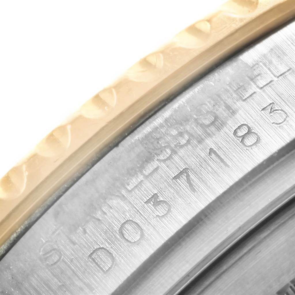 This image shows a close-up of the engraved stainless steel bezel and the edge of the gold bezel of a Rolex Yacht-Master 16623 Men's Stainless Steel White Dial 16623 Men's Stainless Steel White Dial watch.