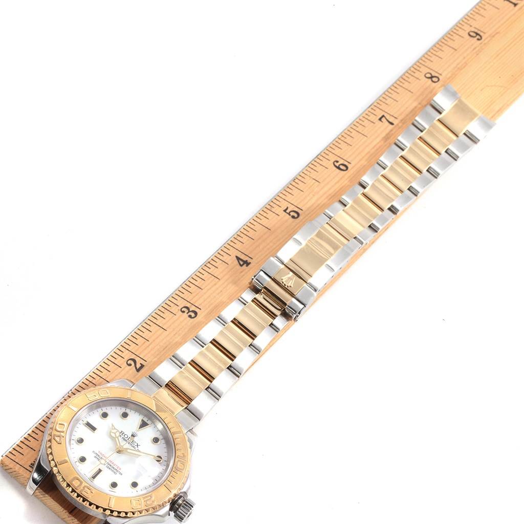 The image shows a Rolex Yacht-Master 16623 Men's Stainless Steel White Dial 16623 Men's Stainless Steel White Dial watch laid flat next to a ruler, displaying its face and bracelet from a top-down angle.