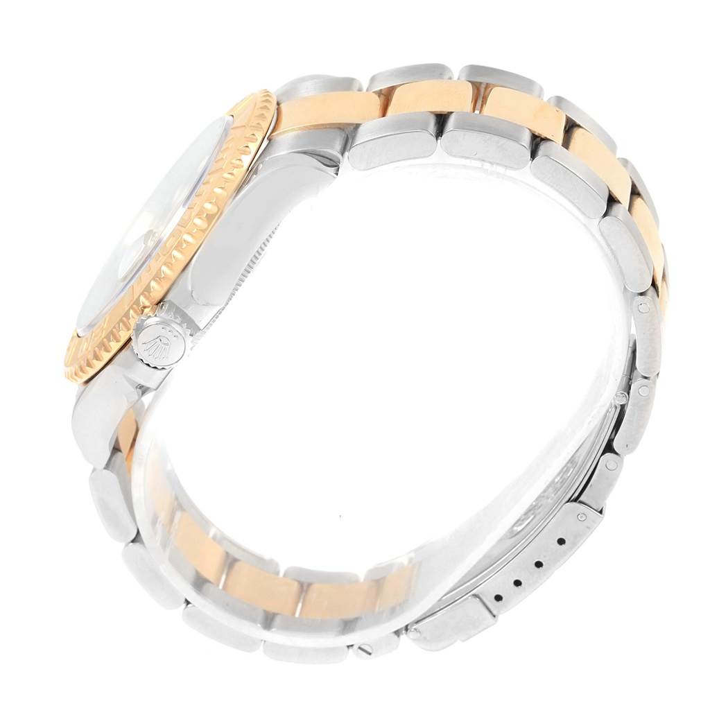 The image shows a side angle of a Rolex Yacht-Master 16623 Men's Stainless Steel White Dial 16623 Men's Stainless Steel White Dial watch, highlighting the two-tone bracelet and the bezel with the crown.