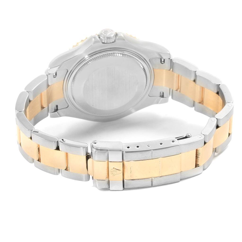 The image shows the back case and bracelet clasp of a Rolex Yacht-Master 168623 Steel and Gold (two tone) White Dial 168623 Steel and Gold (two tone) White Dial watch, highlighting its bi-metal band.