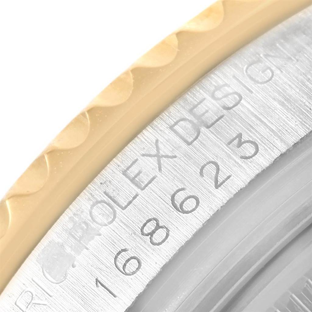 The image shows a close-up of the bezel and case of a Rolex Yacht-Master 168623 Steel and Gold (two tone) White Dial 168623 Steel and Gold (two tone) White Dial watch, highlighting the engraved model details.