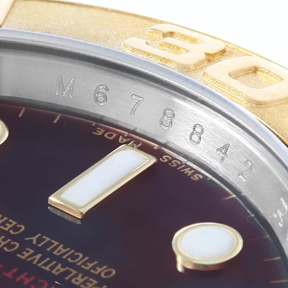 Close-up of the Rolex Yacht-Master 16623 Men's Stainless Steel Mother of Pearl Dial 16623 Men's Stainless Steel Mother of Pearl Dial watch showing the serial number, part of the bezel, and hour markers.