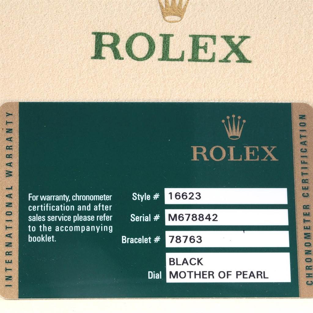 The image shows the warranty card of a Rolex Yacht-Master 16623 Men's Stainless Steel Mother of Pearl Dial 16623 Men's Stainless Steel Mother of Pearl Dial watch, displaying its style, serial, and bracelet numbers, and dial description.