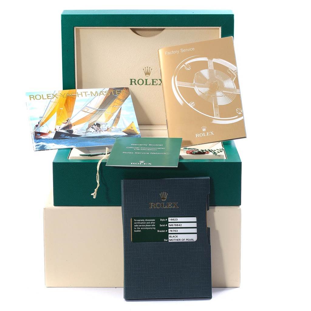 The image shows a Rolex Yacht-Master 16623 Men's Stainless Steel Mother of Pearl Dial 16623 Men's Stainless Steel Mother of Pearl Dial packaging box with manuals and warranty booklets displayed.