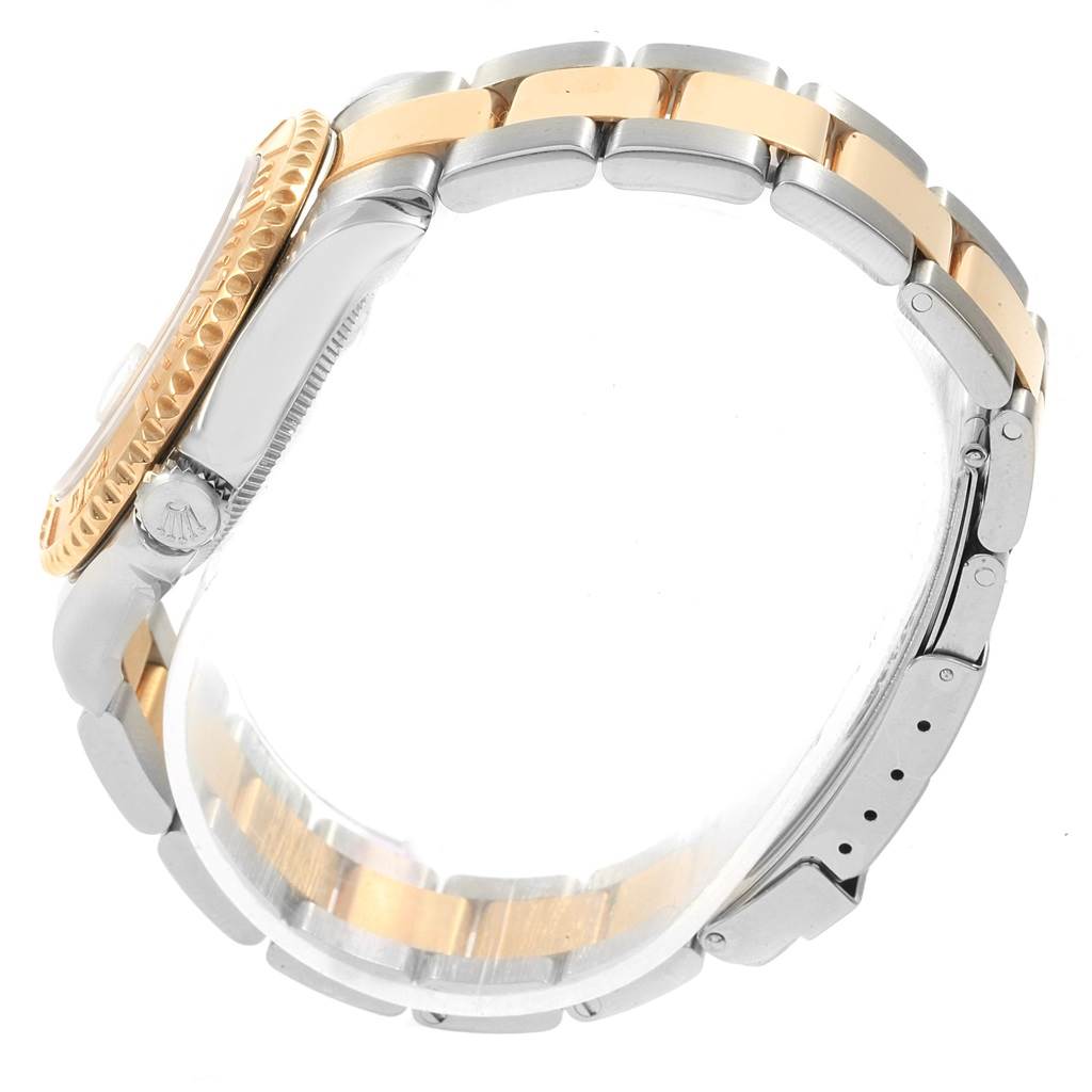 The image shows a side view of a Rolex Yacht-Master 68623 Steel and Gold (two tone) White Dial 68623 Steel and Gold (two tone) White Dial watch, highlighting its two-tone bracelet and bezel.
