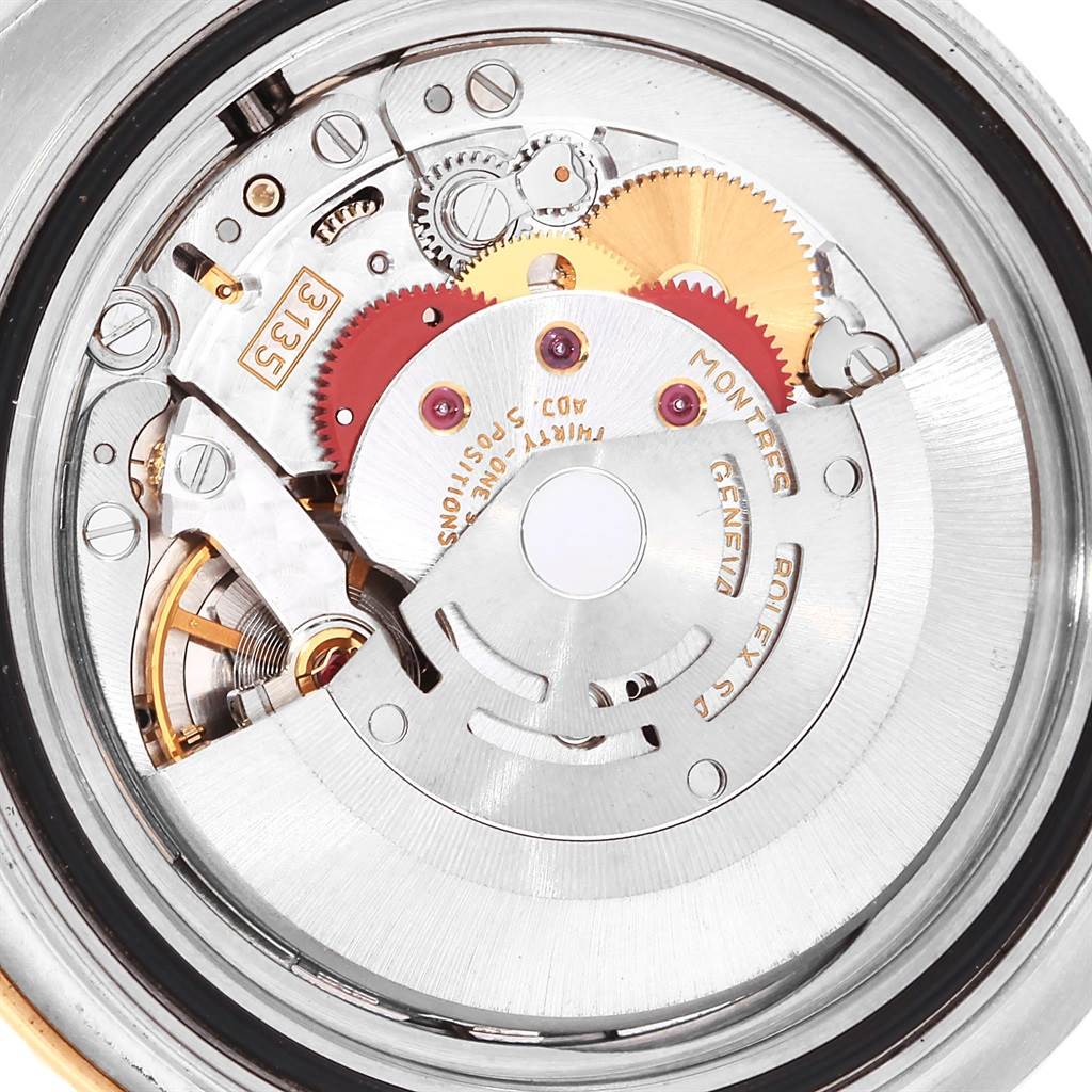 This is a close-up view of the internal movement mechanism of a Rolex Yacht-Master 16623 Men's Stainless Steel White Dial 16623 Men's Stainless Steel White Dial watch, showing gears and components.