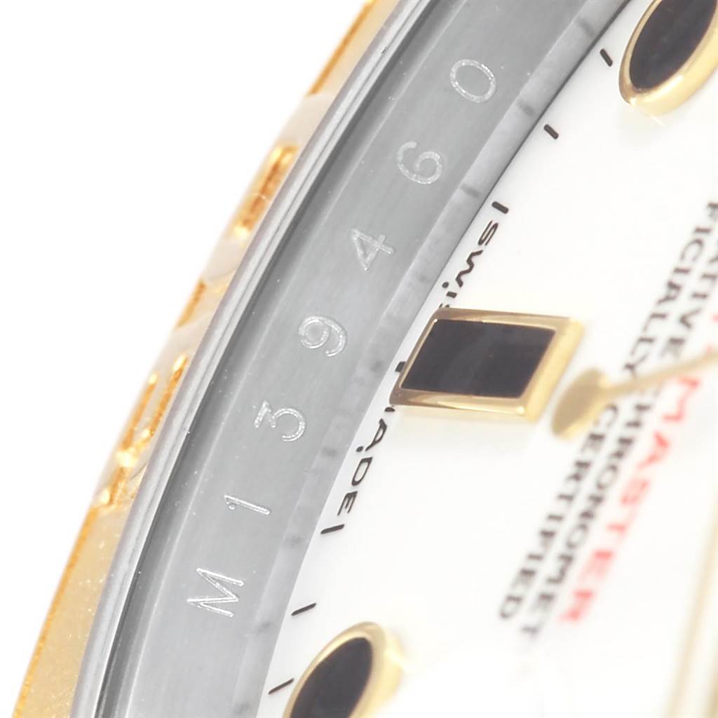 This close-up angle of the Rolex Yacht-Master 16623 Men's Stainless Steel White Dial 16623 Men's Stainless Steel White Dial watch shows part of the bezel, dial, and a portion of the numerals.