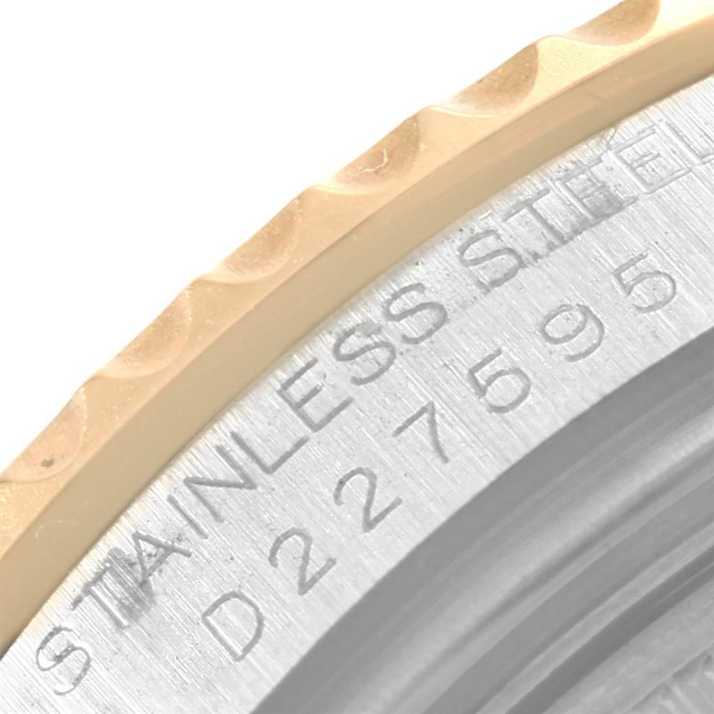 The image shows a close-up of the bezel and part of the case back of a Rolex Yacht-Master 168623 Men's Steel and Gold (two tone) Blue Dial 168623 Men's Steel and Gold (two tone) Blue Dial watch.