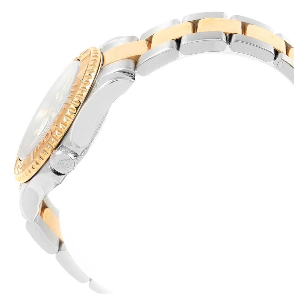 The Rolex Yacht-Master 168623 Men's Steel and Gold (two tone) Blue Dial 168623 Men's Steel and Gold (two tone) Blue Dial watch is shown from a side angle, highlighting its two-tone metal bracelet and crown.