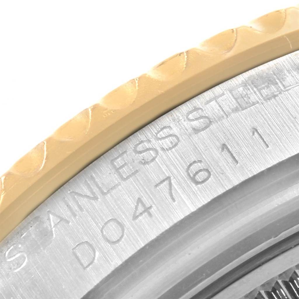 The image shows a close-up of the side view of the bezel and engraved text on a Rolex Yacht-Master 168623 Men's Steel and Gold (two tone) Grey Dial 168623 Men's Steel and Gold (two tone) Grey Dial watch.