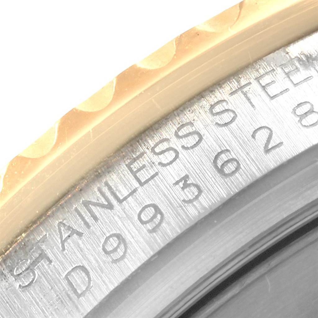 This close-up image displays the engraved serial number and part of the bezel of a Rolex Yacht-Master 16623 Men's Stainless Steel White Dial 16623 Men's Stainless Steel White Dial watch.