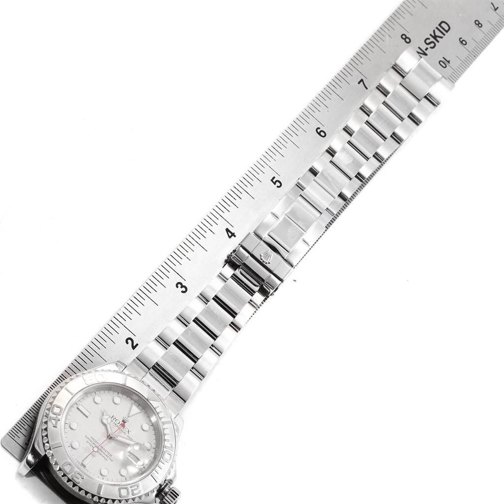 The Rolex Yacht-Master 16622 Men's Stainless Steel Silver Dial 16622 Men's Stainless Steel Silver Dial watch is shown at a top-down angle with the bracelet fully extended next to a ruler.