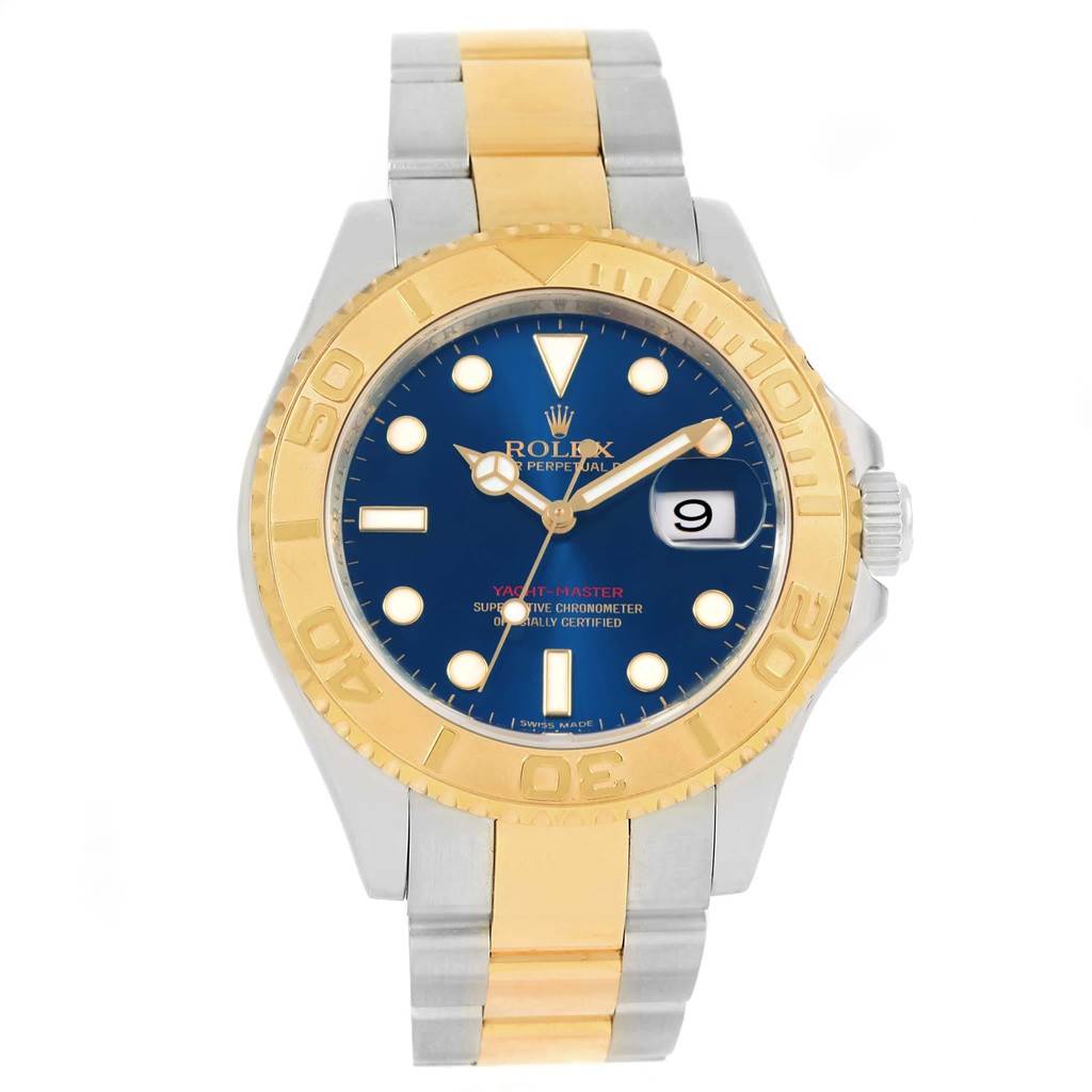 The image shows a front view of the Rolex Yacht-Master 16623 Men's Stainless Steel Blue Dial 16623 Men's Stainless Steel Blue Dial watch, featuring a blue dial, gold bezel, and a two-tone metal bracelet.