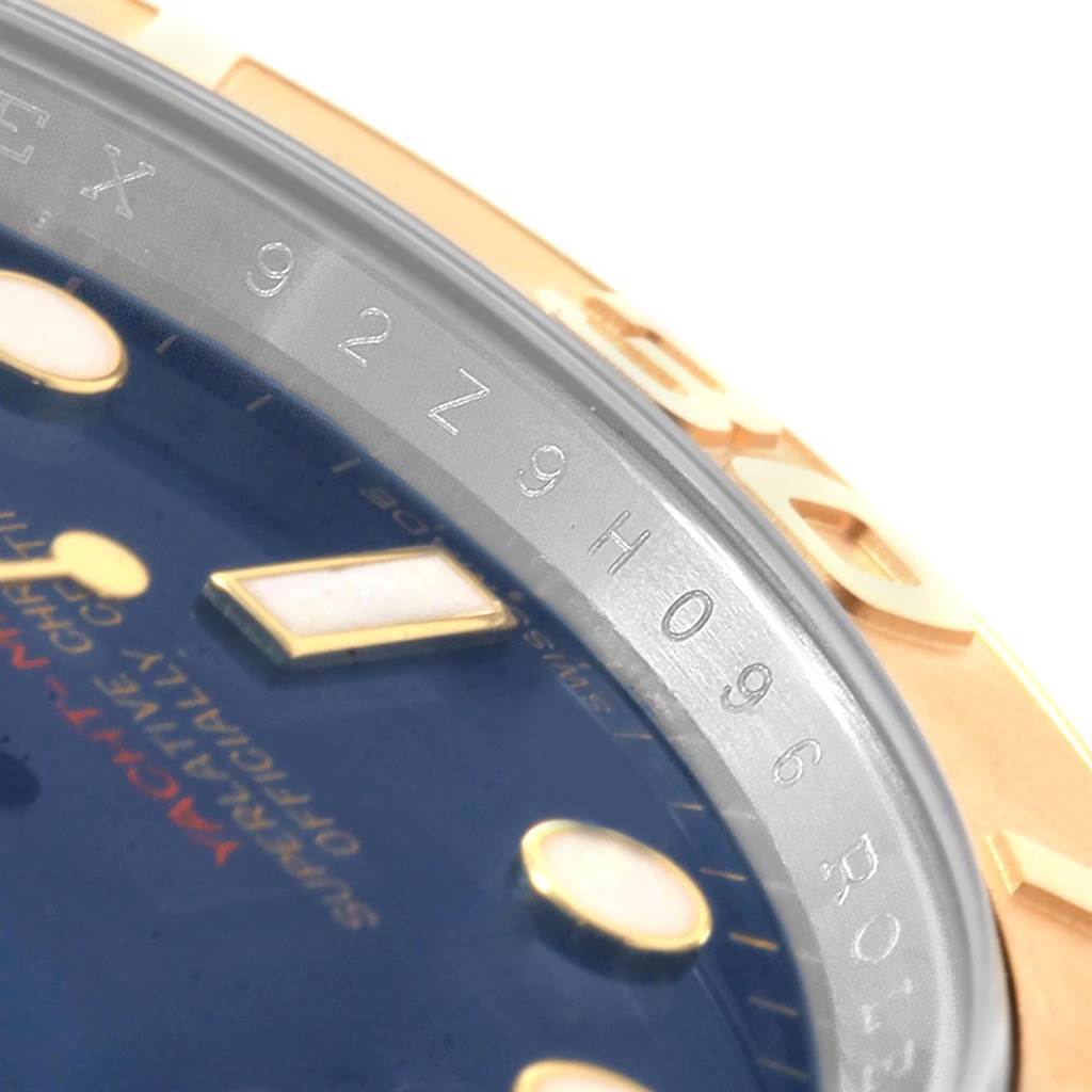 The image shows a close-up of a Rolex Yacht-Master 16623 Men's Stainless Steel Blue Dial 16623 Men's Stainless Steel Blue Dial watch, focusing on the bezel and part of the dial.