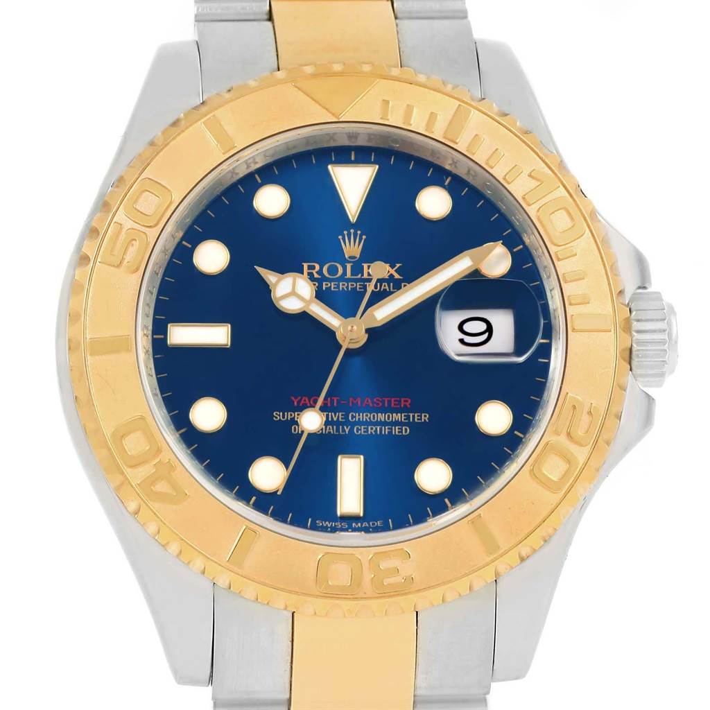 This image shows the face and upper portion of the band of a Rolex Yacht-Master 16623 Men's Stainless Steel Blue Dial 16623 Men's Stainless Steel Blue Dial watch with a blue dial and gold bezel.