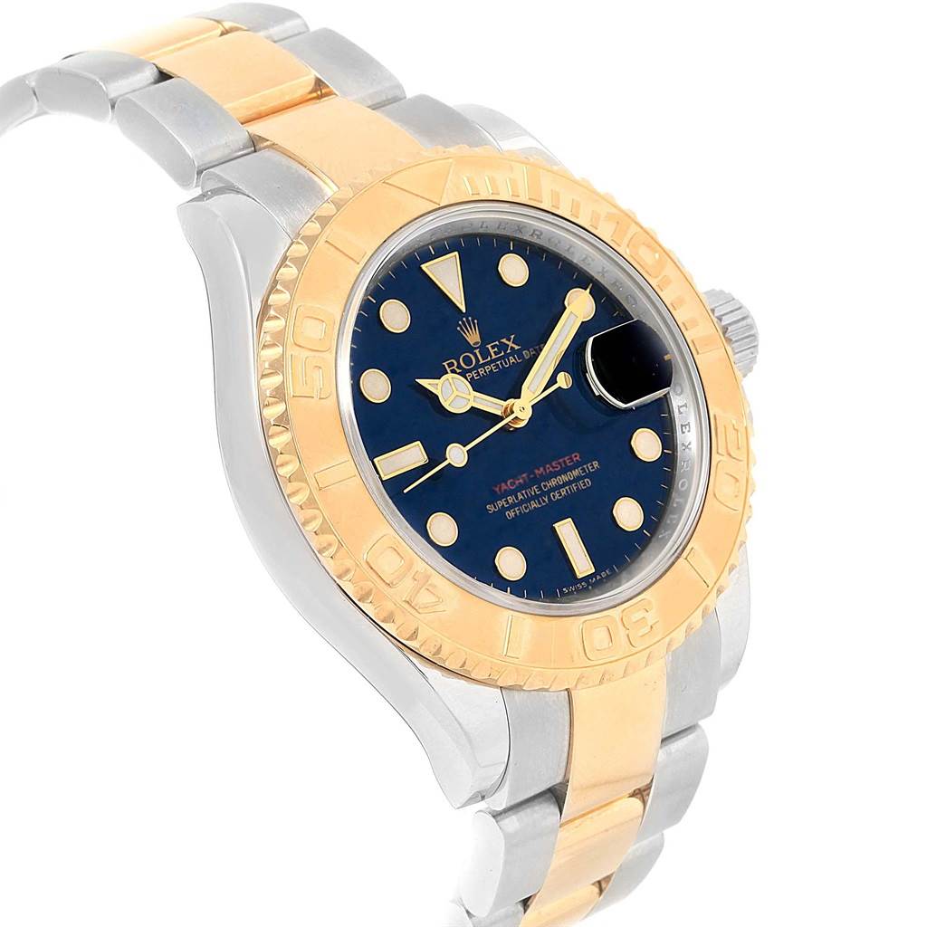 This image shows a Rolex Yacht-Master 16623 Men's Stainless Steel Blue Dial 16623 Men's Stainless Steel Blue Dial watch at a slight angle, highlighting its blue dial, gold bezel, and two-tone bracelet.